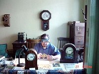 The Park provides a space where one can work in an atmosphere very much like a watch and clock shop at the turn of the century. Chuck Edwards is working on a clock movement. The tools, work bench, furniture and other items look very much like an old time clock shop!