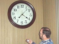 Chuck Edwards synchronizes his railroad watch before bording passengers for the 4:30 train to Houston.