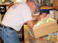 Hugh Linsay making a stencil.