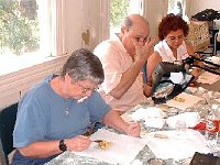 Loraine Walker, Len Kaufman and Lisa Kaufman are hard at work! The painting and gold leaf classes tend to attract ladies.