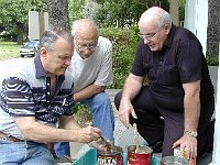 Sometimes it works out best to take this kind of work out on the front porch. Left to right are Phil Gregory, Al Kulakoff, and Dick Michael (instructor).