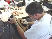 Alex Santa-Pinter is preparing his clock for an application of shellac finish.