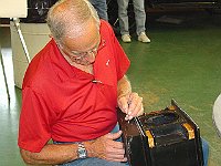 Dick Ganschow works on the finish on his American shelf clock.