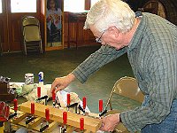 Earl Wilson adjusts the clamps on his veneer project.