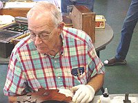 Bob Langston checks out the progress on his clock.