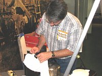 Craig Burgess steaming veneer for fitting on a curved surface.