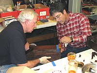 Craig Burgess illustrating the veneering process for Joe Giles.