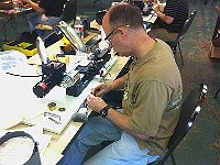 Ronnie Mathis is setting up a cutting tool.