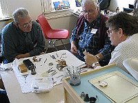 Left to Right Pete Cronos, Lehr Dircks (Instructor) and Clinton Kleen during pocket watch demostration