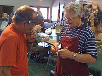 Instructor Fred Tischler discusses a particular situation with Bruce Woolridge.