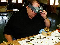 John Erickson assembling his clock.