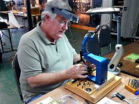 Mark is learning the in's and out's of a bushing machine.