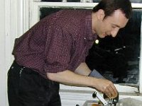 John Tope uses a mainspring winder. A mainspring winder is a very important tool in the clock repair shop.