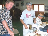 Instructor Mark Vozar checks out Ken Cotter's movement which is ready to test.  Bill Obershaw is in the background.