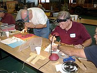 Bruce Wooldridge helps David Lippe, while Kelsy Downum, Mike Granderson and Phil Gregory work on movements.