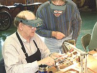 Russ Aikins (our master instructor) and Bela Marton: Russ is showing Bela the proper way to drill on the Jewelers Lathe.