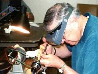 Bob May is very careful as he locates the center of his arbor and drills for a pivot.