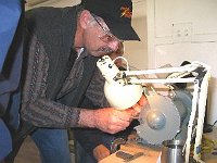 Bill Andrle working at the bench grinder.