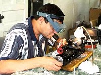 Alex Santa-Pinter is using a Sherline to cut an aluminum tool used to remove the spindle in a jeweler's lathe. This is the first student project after they grind their cutting tools for their lathe.