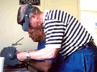 Pat Flanagan and Larry Grubb grinding their blank tool cutters into a standard cutter and boring cutter.