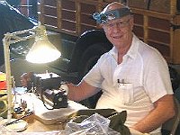 Larry Grubb using his Sherline lathe making a steel die holder for threading.