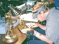 George Tilbury watches the pendulum motion on his clock.