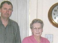 This photo shows David Burton from the UK with the instructor Marybess Grisham. In September of 2003, Earl spent a week in Dallas working and learning in Marybess's shop. Observe the number 34 SWCC clock on the wall. This model was made to be hung outdoors on the platform at the train depot. The vibrations of the trains tended to get the clocks out of beat. This model was designed to get itself back into beat with no human intervention!!