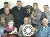 (Left to Right)  Back row:  John Sparks, Jimmy Busby (assistant instructor), George Tilbury and Bob Cockrum. Center row:  Bill Edwards. Front row:  Marybess Grisham (instructor), Jerry Carlman and Jim Schonaerts. Not pictured is Joe Plunkett. The class learned to repair previously botched movements, to correctly wire and to bush the Self Winding clocks.