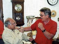 Joe Veneziano and Fred Tischler (instructor) discussing some of the finer points of clock repair.