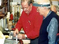 John Kohler and Art Brody reviewing safe use of a mainspring winder.