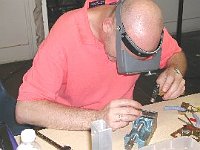 Sometimes all you need to fix a clock is a big hammer. Assistant instructor Phil Ball demonstrates this skill!