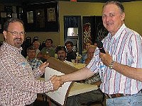 NAWCC National Director and Chapter 124 member Phil Gregory presents a PRESIDENTIAL CITATION awarded to the Chapter at the NAWCC National in Ft Lauderdale to Past President Chuck Edwards.