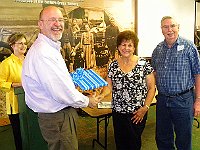 Evelyn and Hugh Slough received a gift from the Chapter as thanks for establishing and administering the Bella Library Exhibit.  The exhibit moves from library to library on a monthly basis.  Phil Ball made the presentation.