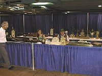 One of the functions at the National which was handled by Chapter 124 was the auction. The auctioneer was Chapter 124 President Ron Slama. In this photo, you see Phil Gregory and Karen Summerville sitting amongst the clocks to be auctioned.  Chapter 124 members that worked the auction are: Ron Slama, auctioner; Phil Gregory, administration; Leslie Slama, bid recorder; Karen Summerville, head cashier; Debbie Andrle, cashier; Carroll Rosamond, Trent Pierce, Al Kulakoff, Bill Andrle, Claude Leis, Robin Quick, Randy Nowak, and Jim Summerville, item runners before and during the auction.   There were 21 sellers at the auction; 143 clocks, tools and watches for sale; 96 were sold at a cost of $42,000.