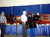 The music boxes in the exhibit were a big hit at this National. Here Chapter 124 members Ron and Cynthia Gilroy of Galveston, Texas enjoy viewing these wonderful pieces.