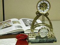 Another of Richard Cox's entries in the craft competition. This one won a second prize. The clock is a French Table Clock. The clock uses an "Old French Movement". The plates and case were copied from the book "American and Continental Skeletons". The clock was entered in "Other Materials Clock Cases".