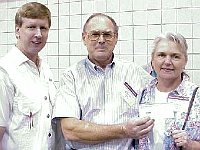 Linda Quinn of Tulsa, OK was the winner of the $500 door prize. Linda is shown here with her husband Charles and Chapter 124 President Jimmy Young.