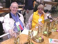 NAWCC 2nd Vice President (and Chapter 124 member) John Hubby displays some of his torsion suspension clocks. We all know these clocks as 400 day clocks, or anniversary clocks. John is a recognized authority on these clocks. With John is Kathy Salak.