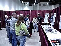 Part of the exhibit this year was devoted to high quality railroad watches. This photo shows Scott Stauffer leading a tour of that area and explaining the details of some of the watches.