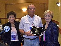 The David Tips Volunteer of the Year Award was presented to Bruce Wooldridge  by Chapter 124 President Evelyn Slough and awards committee chairperson Pam Tischler.